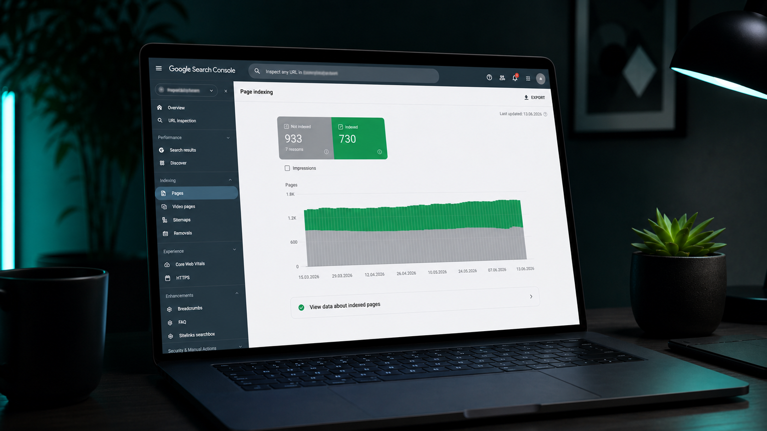 A laptop on a desk showing the Google Search Console Page indexing report with an indexed versus not indexed chart